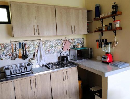 Kuchyň nebo kuchyňský kout v ubytování Edén Los Abuelos 2 - Casa Privada en Minca Nature