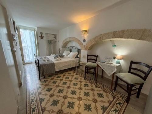 Postel nebo postele na pokoji v ubytování Palazzo Acquaviva