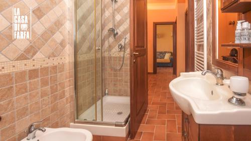 a bathroom with a shower and a sink at La Casa di Farfa - Lovely Home in Sabina in Bocchignano
