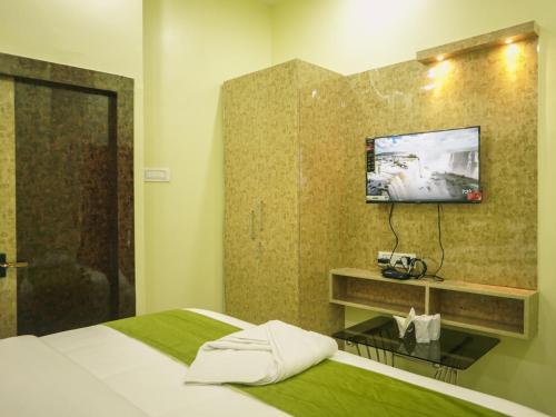 Ein Bett oder Betten in einem Zimmer der Unterkunft Hotel Raventa