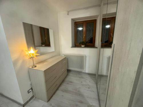 a bathroom with a shower and a star on a dresser at Casa Nada in Neive