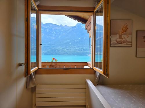 a room with a window with a view of the ocean at Chalet Swiss Alps in Niederried