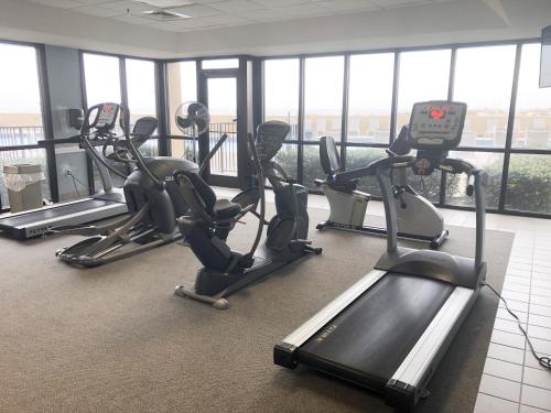 a gym with treadmills and ellipticals in a building at Phoenix V 202 in Orange Beach