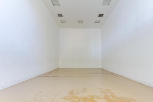 an empty room with white walls and a white floor at Phoenix V 202 in Orange Beach