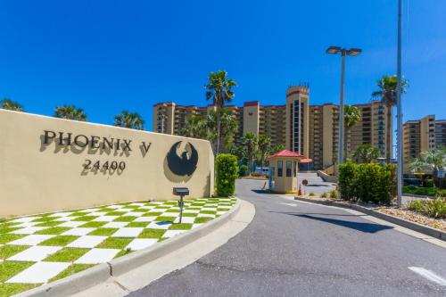 a sign for the phoenix bay zoo with a checkered road at Phoenix V 202 in Orange Beach