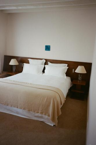 Hôtel Masséにあるベッド