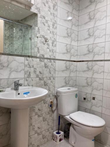 a bathroom with a toilet and a sink at Cozy apartment in Ifrane in Ifrane
