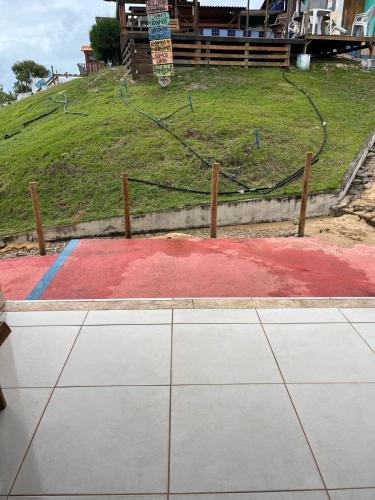 a skate park with a ramp in front of a hill at Pousada Bugaendrus in Touros