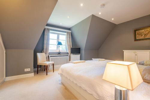 Voodi või voodid majutusasutuse Sonnenhues-Exkl-Haus-im-Herzen-Kampens toas