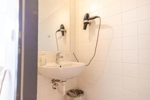 a bathroom with a sink and a mirror at Hotel Astral Vienna in Vienna