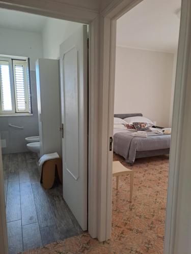 an open door to a bedroom with a bed at San Michele Apartment in Bari