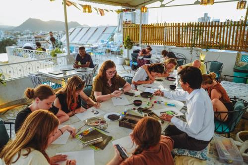 a group of people sitting around a table at Dreamyard Udaipur in Udaipur