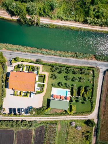 an aerial view of a house next to a body of water at Olivia La Casa sul fiume in Terracina