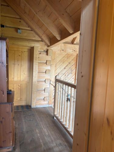 a wooden room with a staircase in a cabin at Pandy B&B in Dorstone