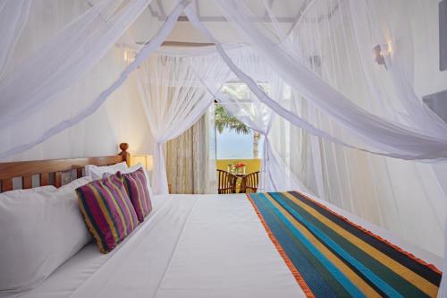 Ένα ή περισσότερα κρεβάτια σε δωμάτιο στο Mahi Beach Ayurveda