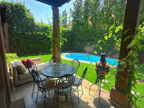 Bazén v ubytování Villa Palmia piscine privée palmeraie Marrakech nebo v jeho okolí