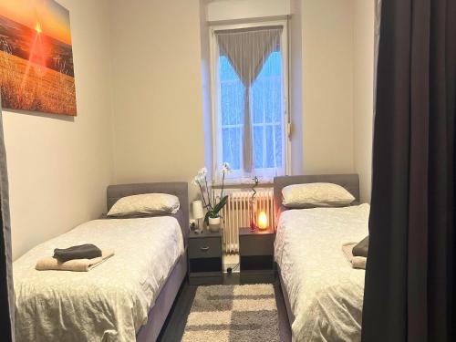 Ένα ή περισσότερα κρεβάτια σε δωμάτιο στο Apartment in Pellingen near Trier & Nature Park