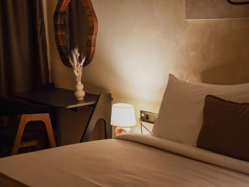 Katil atau katil-katil dalam bilik di Zyra boutique hotel