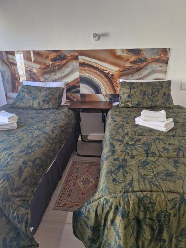 Postel nebo postele na pokoji v ubytování Dundee Viks Guest House