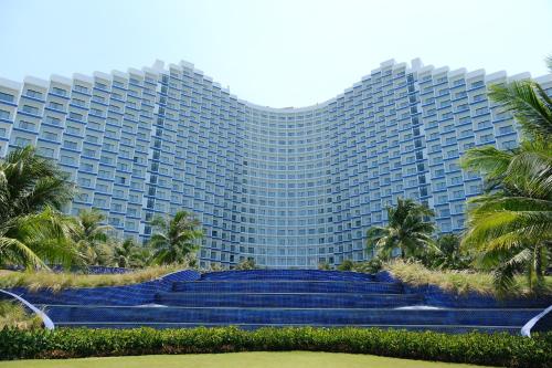 a large building with blue stairs in front of it at Luxury Beach Resort - Arena Cam Ranh in Cam Ranh International Airport