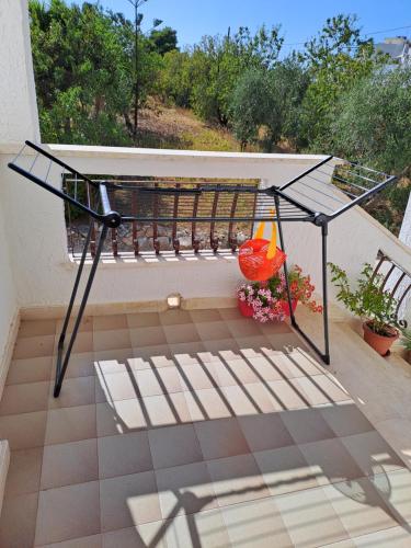 a metal bench on a balcony with a view at San Michele Apartment in Bari
