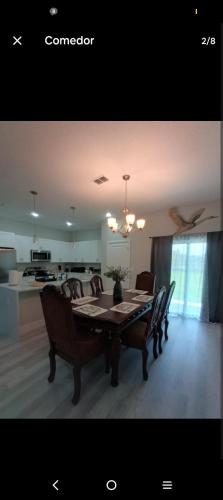 a dining room table and chairs in a room at Beautiful house in quiet place shared bath in Ocala