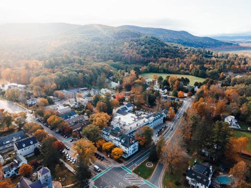 an aerial view of a town with trees and buildings at The Red Lion Inn in Stockbridge