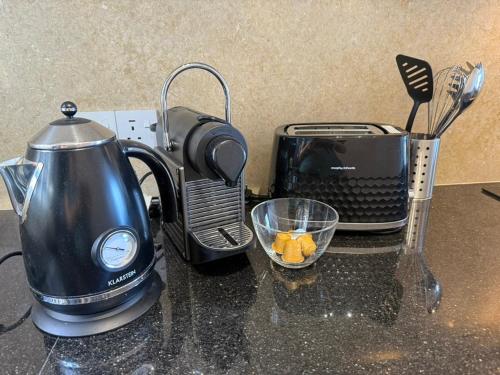 a kitchen counter with a blender and a toaster at Panoramic Seaview Apartment, Chlorakas, Paphos in Chlorakas