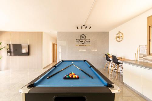 a pool table in the middle of a room at וילת נופש המלך שלמה in Wadi Keren