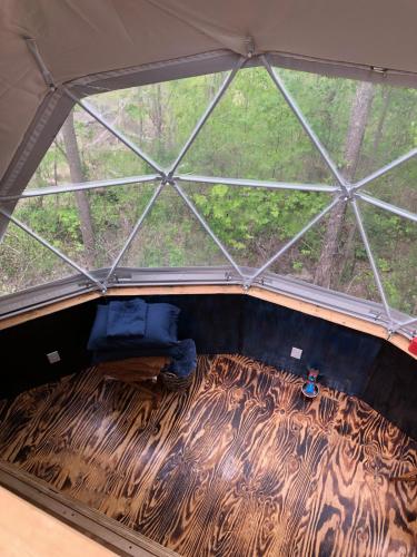 an overhead view of a tent with a bed in the middle at Humble Hippie in Rogers