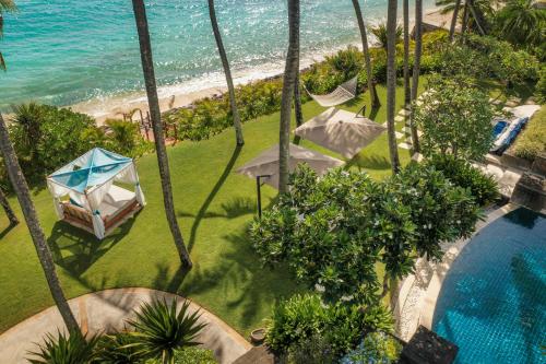 an aerial view of a resort with a swimming pool and the ocean at One&Only Le Saint Géran, Mauritius in Belle Mare