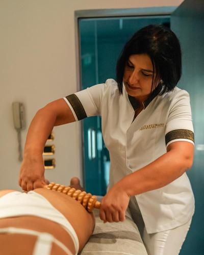 a woman is tying at Altafiumara Resort & Spa in Villa San Giovanni