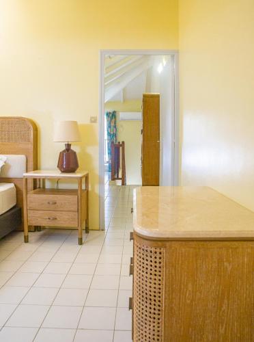 Postel nebo postele na pokoji v ubytování Résidence Le Vallon Guadeloupe Parc Piscine Appartements & Studios