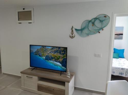 TV a/nebo společenská místnost v ubytování Seaside Aguila Playa 326