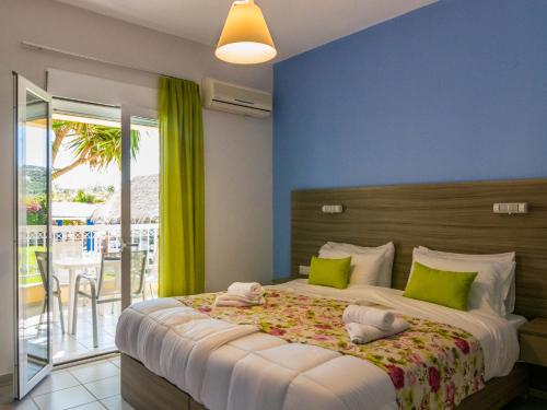 Postel nebo postele na pokoji v ubytování Evelin Hotel