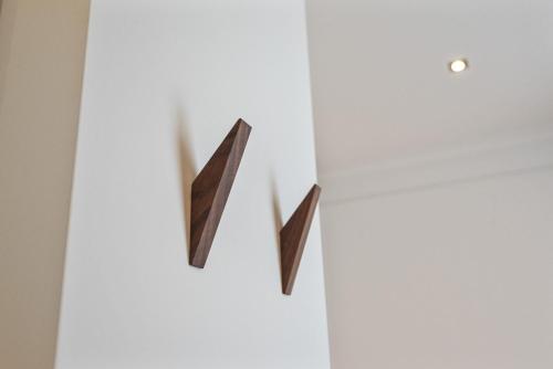 a white cabinet with two black wooden handles at Boutique hotel Novi in Zandvoort
