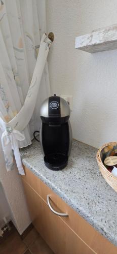 a appliance sitting on top of a kitchen counter at Apollo 56 - neu renovierte Wohnung in Leukerbad