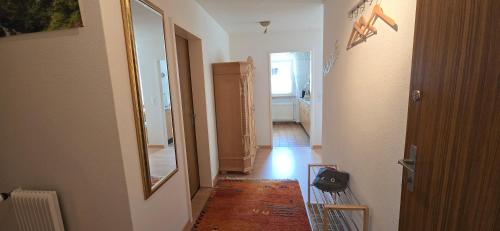 a room with a hallway with a mirror and a hallway sidx sidx sidx at Apollo 56 - neu renovierte Wohnung in Leukerbad