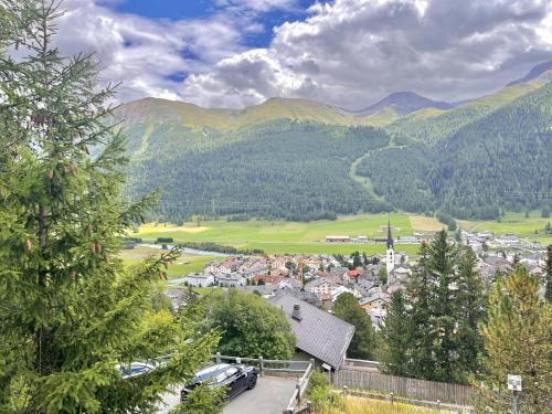 a town in a valley with mountains in the background at Chesa Flurigna - Zuoz in Zuoz