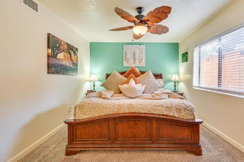 a bedroom with a bed with a ceiling fan at The Painted Pony Sedona Condo Pool and Gym Access in Sedona
