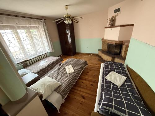 Postel nebo postele na pokoji v ubytování Viršutinė 9 Pirtis