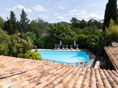 a swimming pool on the roof of a house at Chateau Maravenne in La Londe-les-Maures