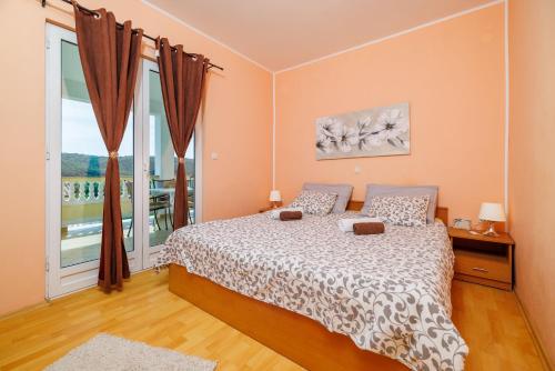 Ένα ή περισσότερα κρεβάτια σε δωμάτιο στο Apartments Roby