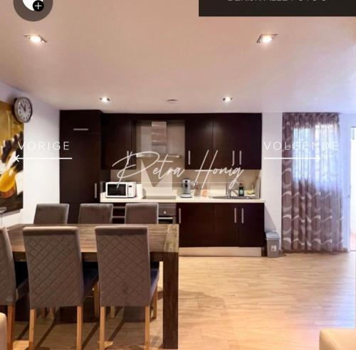 a kitchen and dining room with a table and chairs at Quickcasaspain sl in Rojales