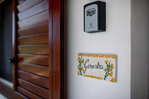 a sign on the side of a door at Limora' Tenuta Millaci in Mazzarino