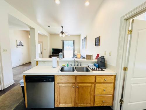 a kitchen with a sink and a stove at Chateau 11 in Hammond
