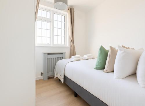 Ένα ή περισσότερα κρεβάτια σε δωμάτιο στο Beautiful and cosy room in Morden