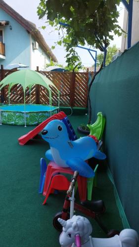 a childs playground with a toy bird on a chair at REMINA in Sulina