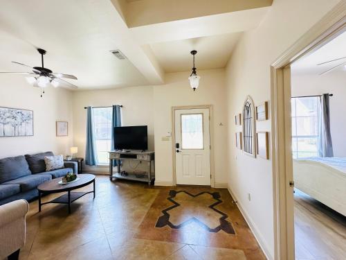 a living room with a couch and a bed at Chateau 10 in Hammond