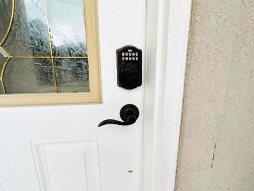 a door with a remote control attached to it at Chateau 10 in Hammond
